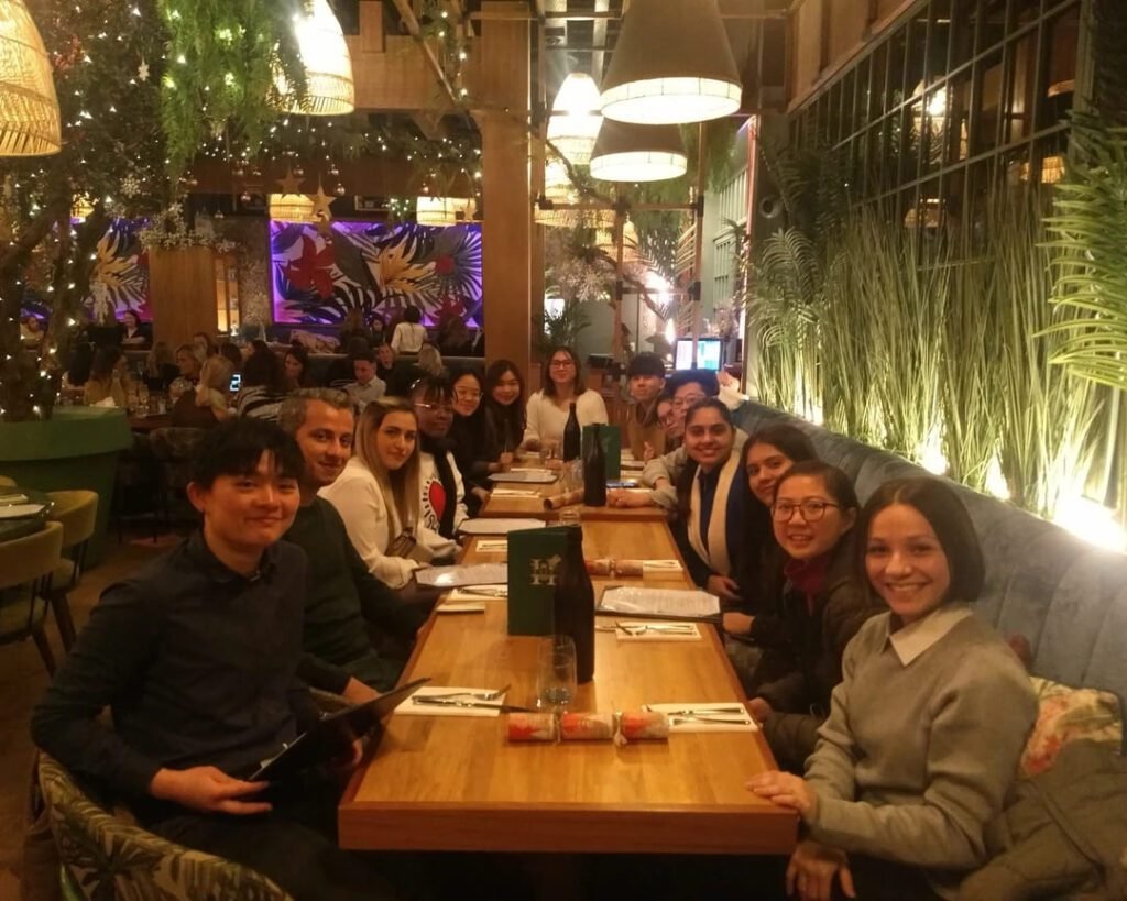 International Student Society members enjoying a dinner at a vibrant restaurant in Galway.